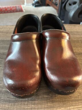 Dansko women’s Brown Leather Slip-On Clogs